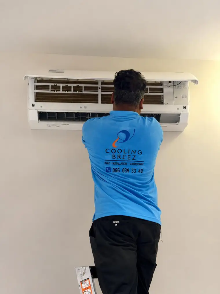Cooling Breez HVAC technician performing AC maintenance in Saudi Arabia